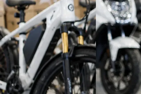 Electric bikes and scooters displayed inside a commercial mobility showroom